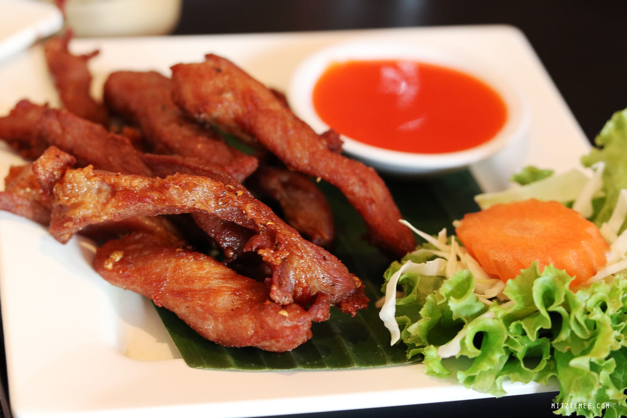 Sun-dried, deep-fried pork at Somtum Der, Bangkok