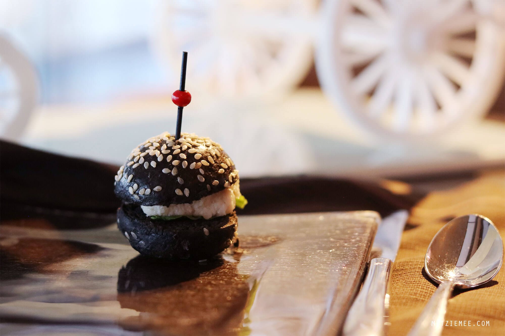  On my last day in Hong Kong it was pouring down. I had to check out from the hotel at noon, but my flight was not until the evening, and my original plan to go for a walk along the water did not seem very attractive. Instead I called The Ritz-Carlton in Hong Kong and made a reservation for the afternoon tea at Café 103. My table was far from the floor-to-ceiling windows, so even though I was on the 103rd floor, I did not have much of a view. Instead they provided me with different kinds of magazine, so I wouldn’t get bored during my afternoon tea for one. Except for the view (or the lack of it), it was a really nice afternoon tea. First, I was asked to pick the tea I wanted, and it was more difficult than it sounds, because there were so many different kinds to choose among. After consulting the waiter, who turned out to be very well-versed in teas, I finally decided on the Sakura Sakura tea, which was a green tea with cherry blossoms and a mild and flowery flavor. The Ritz-Carlton in Hong Kong are known for collaborations with chefs and different gourmet brands for the afternoon tea, and when I was there, the menu was made in collaboration with luxury candy store Sugarfina, which are particularly known for boozy gummy bears. One of the desserts I had was a champagne cream with strawberry topped with a champagne-infused gummy bear, and it was exquisite. I could have eaten a whole family of those bears:) It was a nice way to spend the afternoon but next time I go, I will try to get a table with a better view. I did a little online research, and it seems like The Lounge & Bar, which is on the 102nd floor and also serves afternoon tea, has more window tables available, so maybe they are a better choice. Otherwise, there is always Ozone, which is the beautiful bar on the 118th floor at the Ritz-Carlton. 