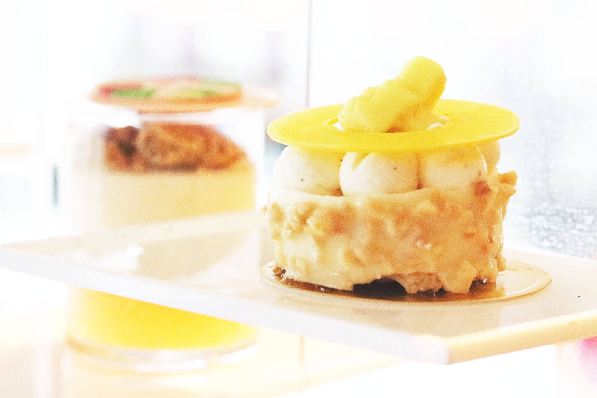  On my last day in Hong Kong it was pouring down. I had to check out from the hotel at noon, but my flight was not until the evening, and my original plan to go for a walk along the water did not seem very attractive. Instead I called The Ritz-Carlton in Hong Kong and made a reservation for the afternoon tea at Café 103. My table was far from the floor-to-ceiling windows, so even though I was on the 103rd floor, I did not have much of a view. Instead they provided me with different kinds of magazine, so I wouldn’t get bored during my afternoon tea for one. Except for the view (or the lack of it), it was a really nice afternoon tea. First, I was asked to pick the tea I wanted, and it was more difficult than it sounds, because there were so many different kinds to choose among. After consulting the waiter, who turned out to be very well-versed in teas, I finally decided on the Sakura Sakura tea, which was a green tea with cherry blossoms and a mild and flowery flavor. The Ritz-Carlton in Hong Kong are known for collaborations with chefs and different gourmet brands for the afternoon tea, and when I was there, the menu was made in collaboration with luxury candy store Sugarfina, which are particularly known for boozy gummy bears. One of the desserts I had was a champagne cream with strawberry topped with a champagne-infused gummy bear, and it was exquisite. I could have eaten a whole family of those bears:) It was a nice way to spend the afternoon but next time I go, I will try to get a table with a better view. I did a little online research, and it seems like The Lounge & Bar, which is on the 102nd floor and also serves afternoon tea, has more window tables available, so maybe they are a better choice. Otherwise, there is always Ozone, which is the beautiful bar on the 118th floor at the Ritz-Carlton. 