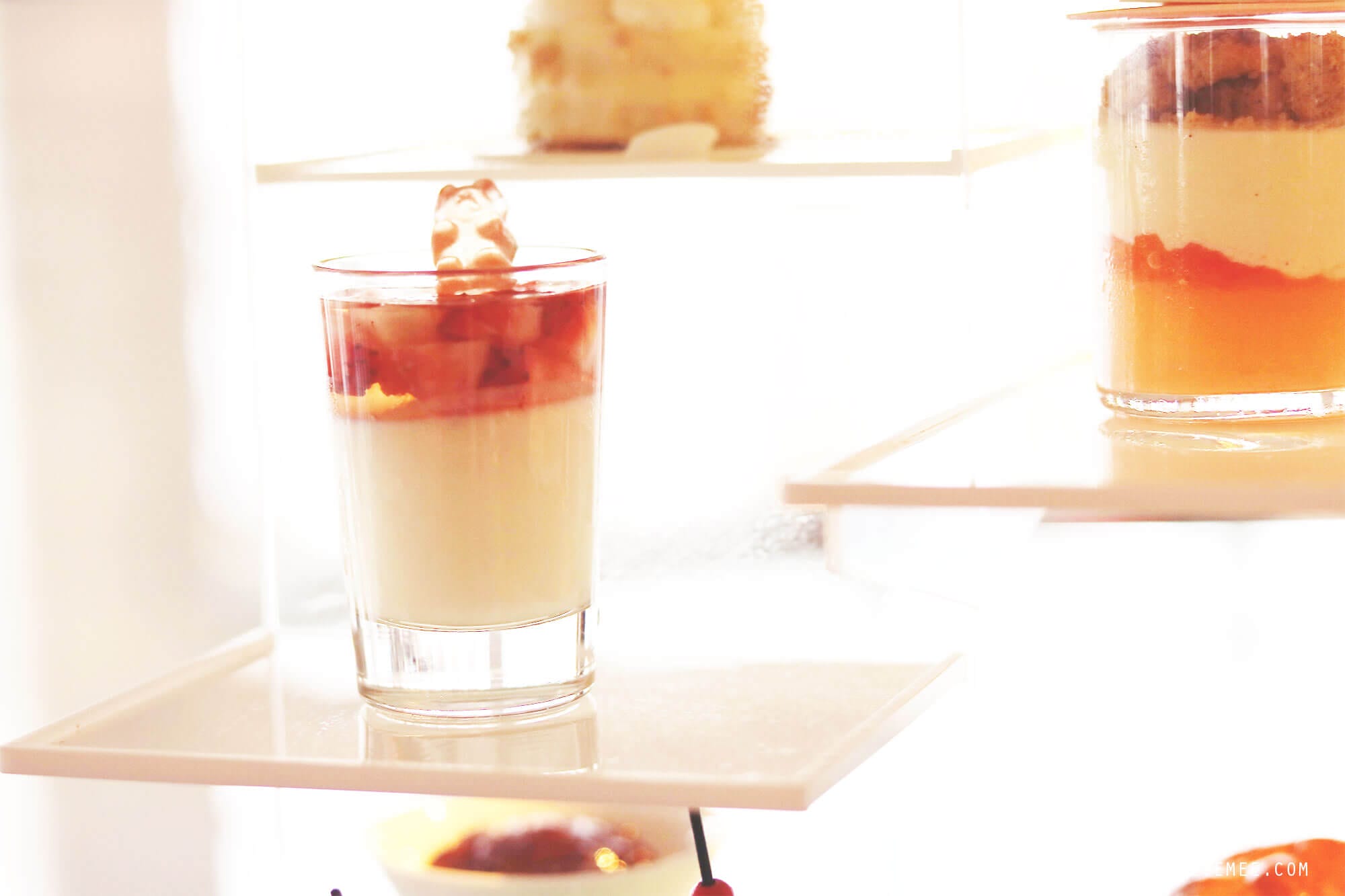  On my last day in Hong Kong it was pouring down. I had to check out from the hotel at noon, but my flight was not until the evening, and my original plan to go for a walk along the water did not seem very attractive. Instead I called The Ritz-Carlton in Hong Kong and made a reservation for the afternoon tea at Café 103. My table was far from the floor-to-ceiling windows, so even though I was on the 103rd floor, I did not have much of a view. Instead they provided me with different kinds of magazine, so I wouldn’t get bored during my afternoon tea for one. Except for the view (or the lack of it), it was a really nice afternoon tea. First, I was asked to pick the tea I wanted, and it was more difficult than it sounds, because there were so many different kinds to choose among. After consulting the waiter, who turned out to be very well-versed in teas, I finally decided on the Sakura Sakura tea, which was a green tea with cherry blossoms and a mild and flowery flavor. The Ritz-Carlton in Hong Kong are known for collaborations with chefs and different gourmet brands for the afternoon tea, and when I was there, the menu was made in collaboration with luxury candy store Sugarfina, which are particularly known for boozy gummy bears. One of the desserts I had was a champagne cream with strawberry topped with a champagne-infused gummy bear, and it was exquisite. I could have eaten a whole family of those bears:) It was a nice way to spend the afternoon but next time I go, I will try to get a table with a better view. I did a little online research, and it seems like The Lounge & Bar, which is on the 102nd floor and also serves afternoon tea, has more window tables available, so maybe they are a better choice. Otherwise, there is always Ozone, which is the beautiful bar on the 118th floor at the Ritz-Carlton. 